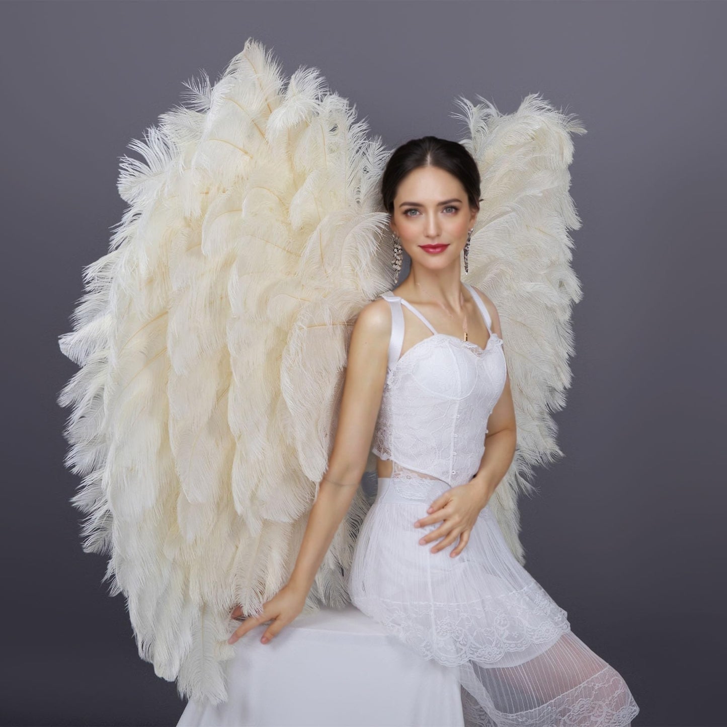 Angel wings made of off - white ostrich feathers. They can fully enhance the atmosphere for photoshoots and fashion shows.